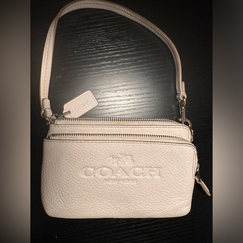 Coach wristlet , cream color